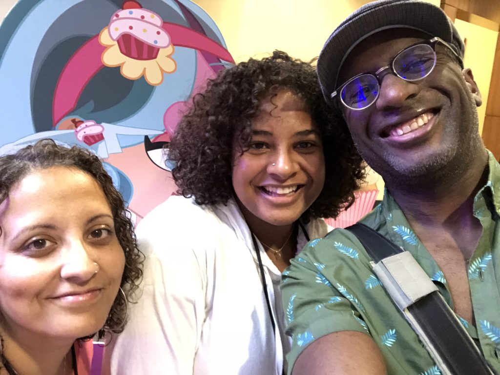 IMG_7847 The author (center) with her parents at BlerdCon. Courtesy of Joycelin Farmer.