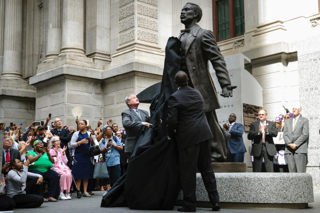 Philadelphia Black Activist Statue Philadelphia Mayor Jim Kenney (center) and sculptor Branly Cadet unveil a statue of Octavius Valentine Catto at City Hall in Philadelphia, Tuesday, Sept. 26, 2017. A century before the fight to end Jim Crow segregation laws, Octavius Valentine Catto was leading a civil rights movement in Philadelphia. (AP Photo/Matt Rourke)
