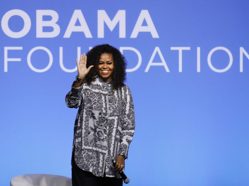 Former U.S. first lady Michelle Obama waves as she attends an event for Obama Foundation in Kuala Lumpur, Malaysia, in December 2019. Obama and actress Julia Roberts attended the inaugural Gathering of Rising Leaders in the Asia Pacific organized by the Obama Foundation. Former U.S. first lady Michelle Obama waves as she attends an event for Obama Foundation in Kuala Lumpur, Malaysia, in December 2019. Obama and actress Julia Roberts attended the inaugural Gathering of Rising Leaders in the Asia Pacific organized by the Obama Foundation. (Vincent Thian/AP Photo)
