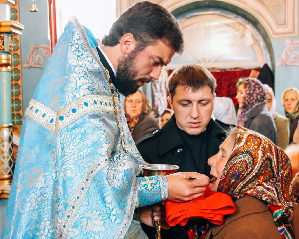 Voyutyn, Volyn / Ukraine – October 14 2009: Priest Conduct The C ( a_mikos/BigStock)
