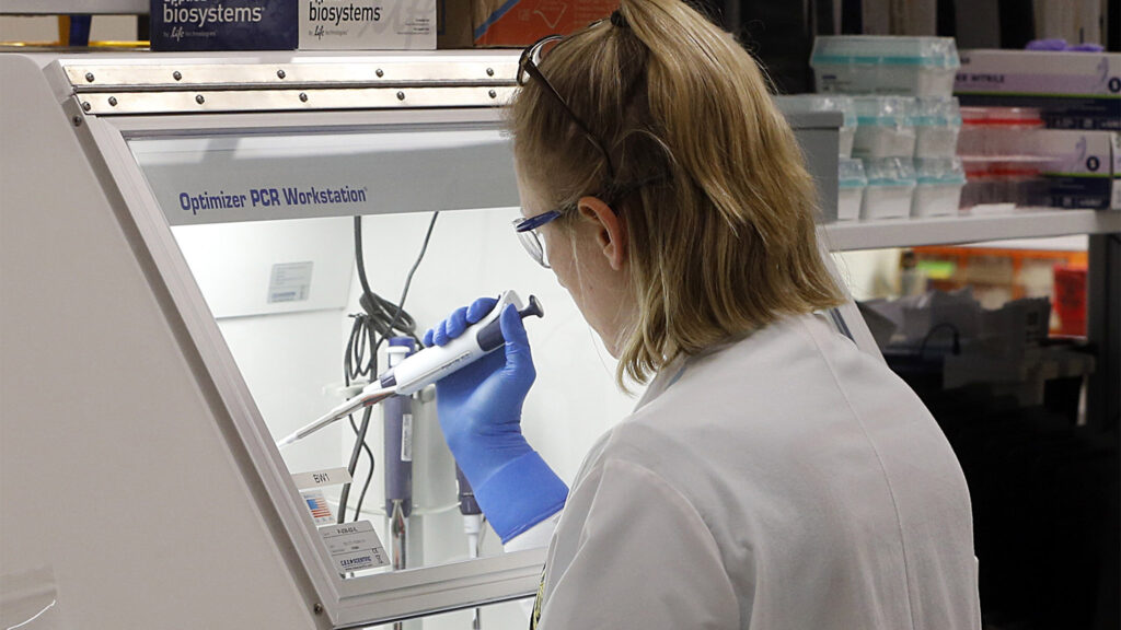 Virus Outbreak Virginia An employee of the Department of General Services Division of Consolidated Laboratories' Virginia Public Health Labratory adds chemicals in the second step of testing a sample for the Coronavirus at the lab in Richmond, Va. on Wednesday, March 4, 2020. (Joe Mahoney/Richmond Times-Dispatch via AP)