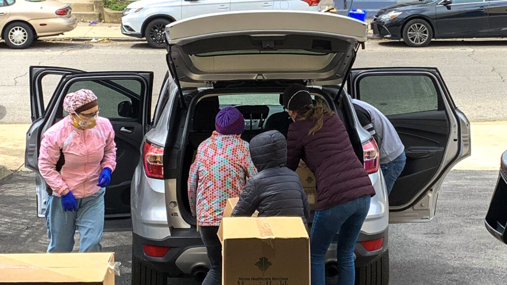 forphilly-fooddelivery-crop For Philly cofounder David Brindley's kids help unload a truck of meal boxes. (Jeff Wicklund of the Enterprise Center)