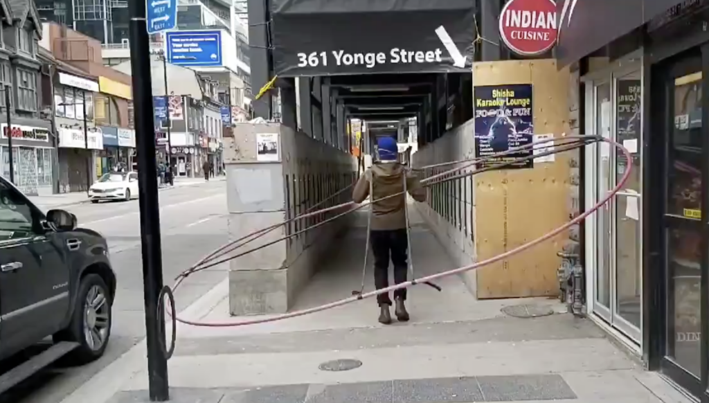social distancing machine A Toronto geographer is using a large ring to study and demonstrate how difficult it is to keep a social distance of six feet in the urban environment. (Daniel Rotsztain)