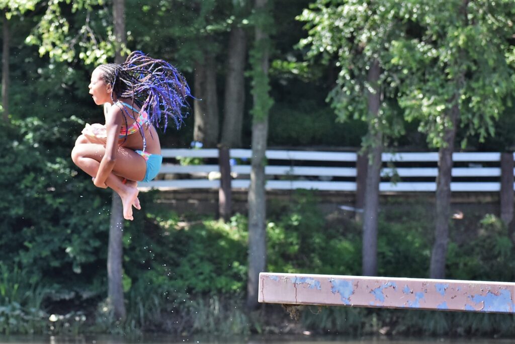 2020 05 15-provided-liberty lake day camp jump Summer camper leaps off a diving platform