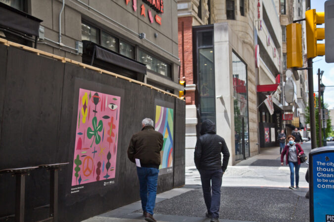 The Mural Arts Program installed works on storefronts boarded up due to coronavirus lockdowns in Center City. This work on Chestnut Street is by artist Martha Rich. (Kimberly Paynter/WHYY)