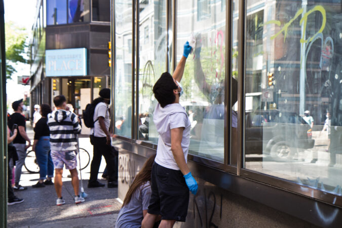 People worked to clean the graffiti everywhere in Center City Philadelphia. (Kimberly Paynter/WHYY)