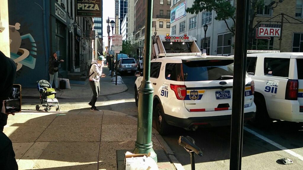 A still from a video showing homeless outreach workers at site of encampment. A still from a video showing homeless outreach workers appearing at 2000 block of Ionic Street in Rittenhouse to clean up an encampment.