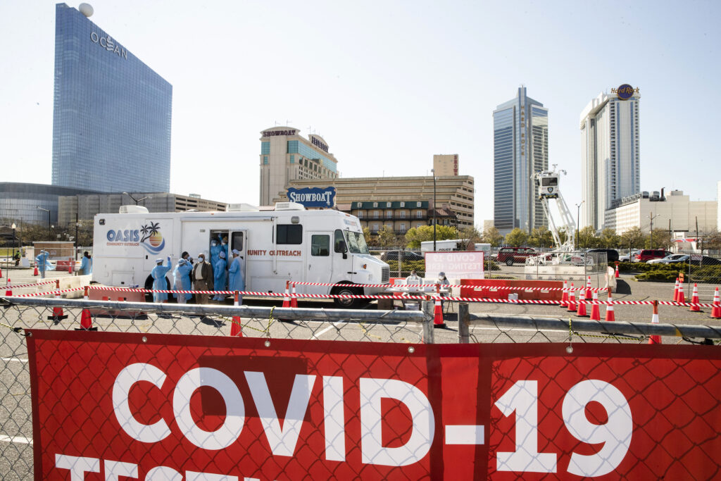 Virus Outbreak New Jersey Medical workers prepare for the opening of a COVID-19 test location in a parking lot near the casinos in Atlantic City, Pa., Tuesday, April 28, 2020. (AP Photo/Matt Rourke)