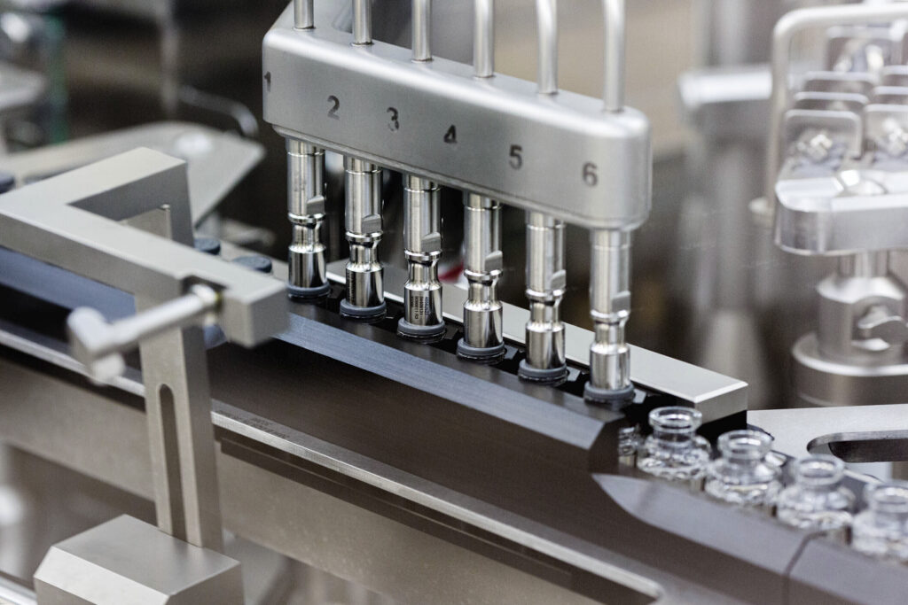 Virus Outbreak Antiviral Drug In this March 2020 photo provided by Gilead Sciences, rubber stoppers are placed onto filled vials of the investigational drug remdesivir at a Gilead manufacturing site in the United States. (Gilead Sciences via AP)