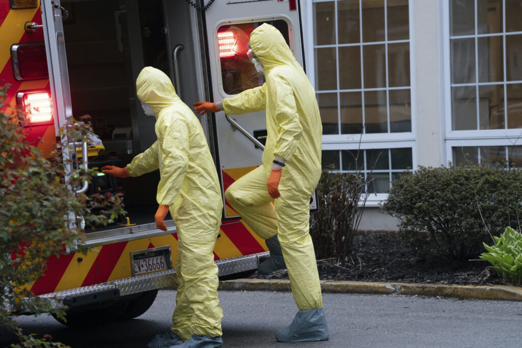 Exchange Virus Outbreak Paramedics Narberth Ambulance Paramedic Andrew Schifferli, left, and EMT Eric McKeever, right, wear full PPE during a call at a nursing home in Wynnewood, PA, on April 17, 2020, in Ardmore, Pa. (Jessica Griffin/Philadelphia Inquirer)