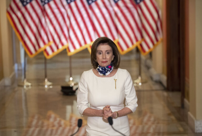 House Speaker Nancy Pelosi of Calif., walks to speak about the so-called Heroes Act, Tuesday, May 12, 2020 on Capitol Hill in Washington.  Pelosi unveiled a more than $3 trillion coronavirus aid package Tuesday, providing nearly $1 trillion for states and cities, “hazard pay” for essential workers and a new round of cash payments to individuals. (Saul Loeb/Pool via AP)