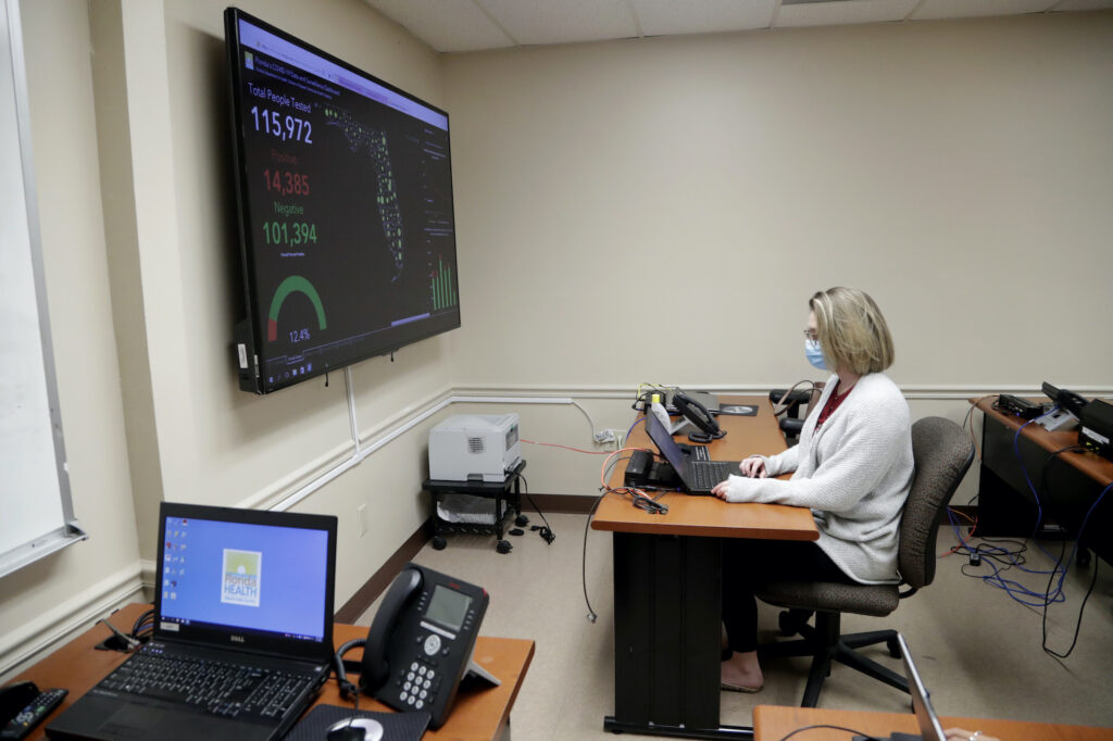 Meghan Peck In this Wednesday, May 13, 2020 photo, Meghan Peck works on contact tracing at the Florida Dept. of Health in Miami-Dade County, during the new coronavirus pandemic, in Doral, Fla. (AP Photo/Lynne Sladky)