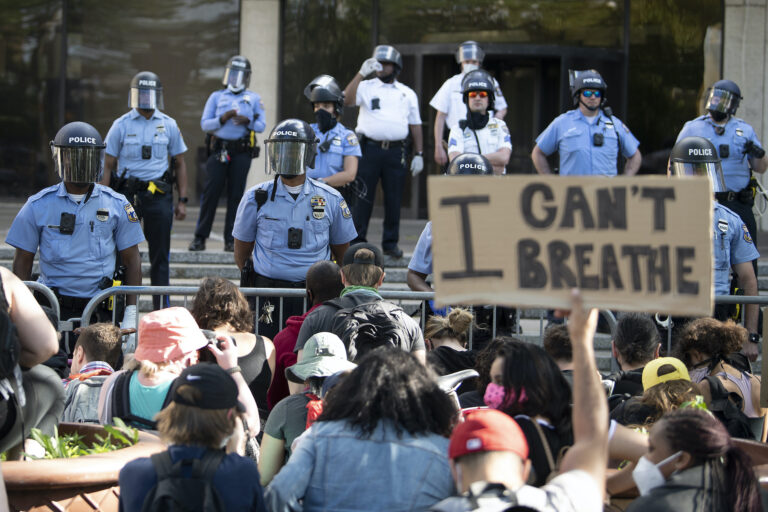 Protesters gather at the Philadelphia Police Department Headquarters during a rally