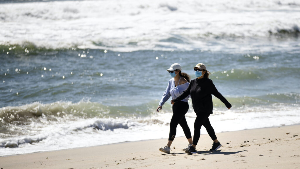 AP_coronavirus_NJ_beach_mask_052020 People wear protective face masks on NJ beach