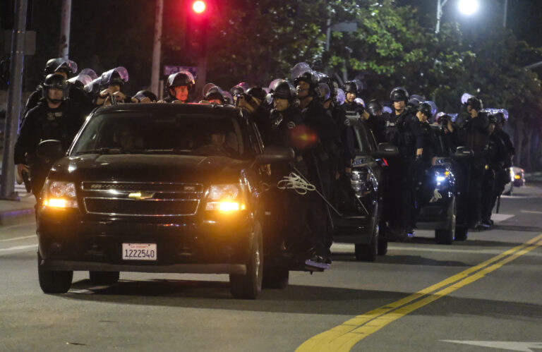 LAPD riot police stand by outside City Hall during a protest of the death of George Floyd