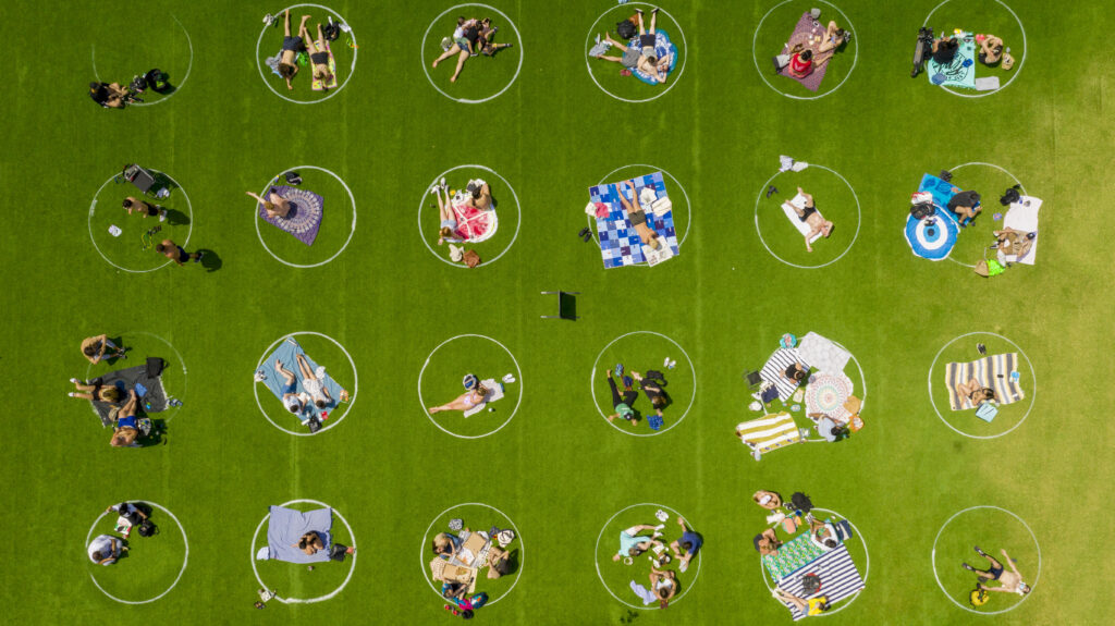 Domino Park Circles Circles drawn on the lawn of Domino Park in Brooklyn help enforce social distancing guidelines. (Two Trees Management)