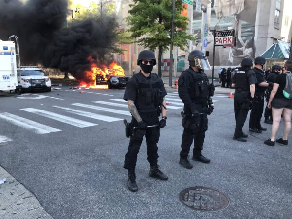 A state police car was set on fire during a march in Center City protesting police violence. (Alan Yu/WHYY)