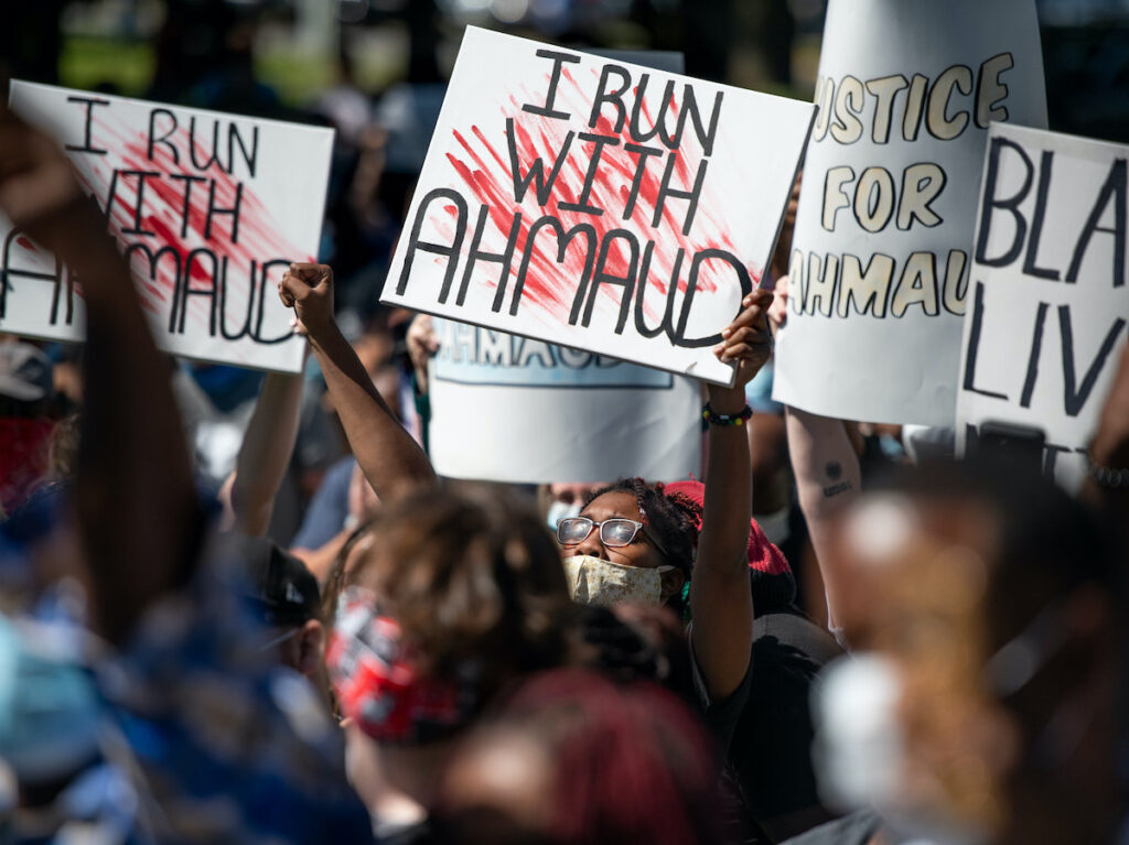 Demonstrators protest the shooting death of Ahmaud Arbery