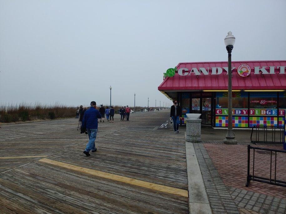 Image from iOS (40) Few people were walking along the Rehoboth Beach boardwalk just hours before the state’s beaches reopened Friday at 5 p.m. (Zoë Read/ WHYY)