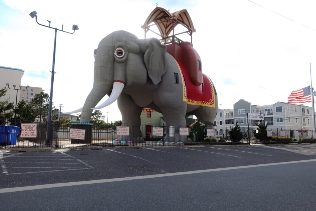 Virus Outbreak New Jersey National Historic Landmark Lucy the Elephant is closed to visitors and the parking lot is empty in Margate, New Jersey, during the coronavirus pandemic while a flag flies at half staff on April 10, 2020. (AP Photo/Ted Shaffrey)