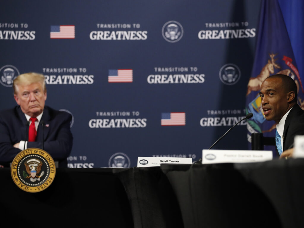 President Trump listens as Scott Turner, executive director of the White House Opportunity and Revitalization Council, speaks during a meeting with African American leaders in Michigan on Thursday. President Trump listens as Scott Turner, executive director of the White House Opportunity and Revitalization Council, speaks during a meeting with African American leaders in Michigan on Thursday. (Alex Brandon/AP Photo)