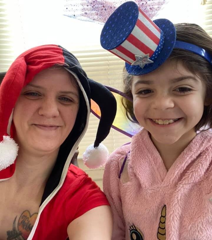Kimberly Gonzalez and her daughter get ready to spread some cheer.