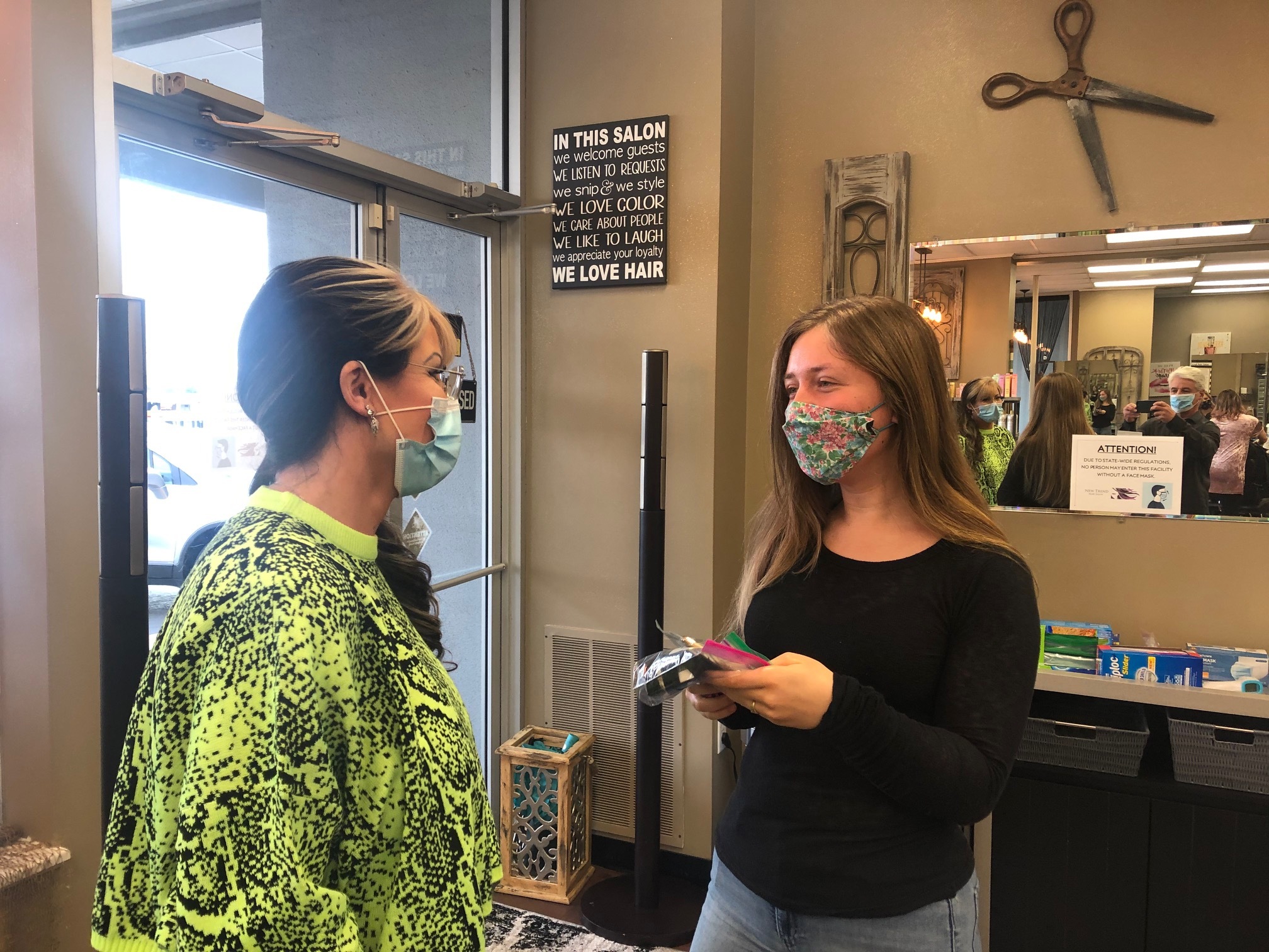 New Trend Hair Salon owner Ginger Casper screens customer Kaitlynn Maciejewski