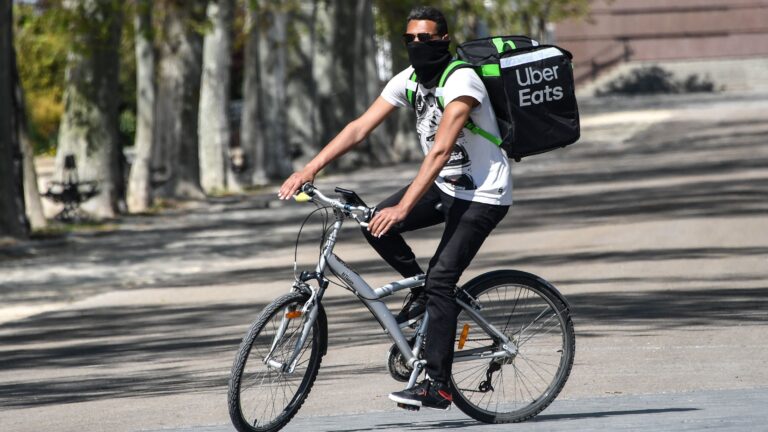 Uber is restructuring its business to focus on rides and food delivery, which has been a bright spot for the company during the pandemic. (Pascal Guyot/AFP via Getty Images)