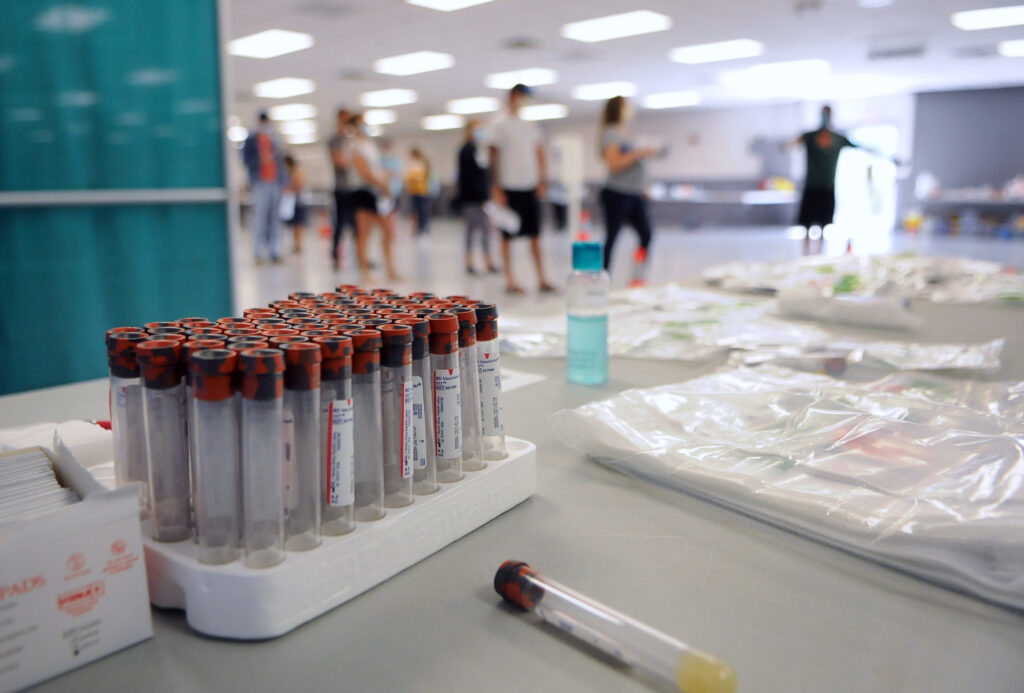 Blood collection tubes sit in a rack on the first day of a free COVID-19 antibody testing event at the Volusia County Fairgrounds in DeLand, Fla., on May 4. Blood collection tubes