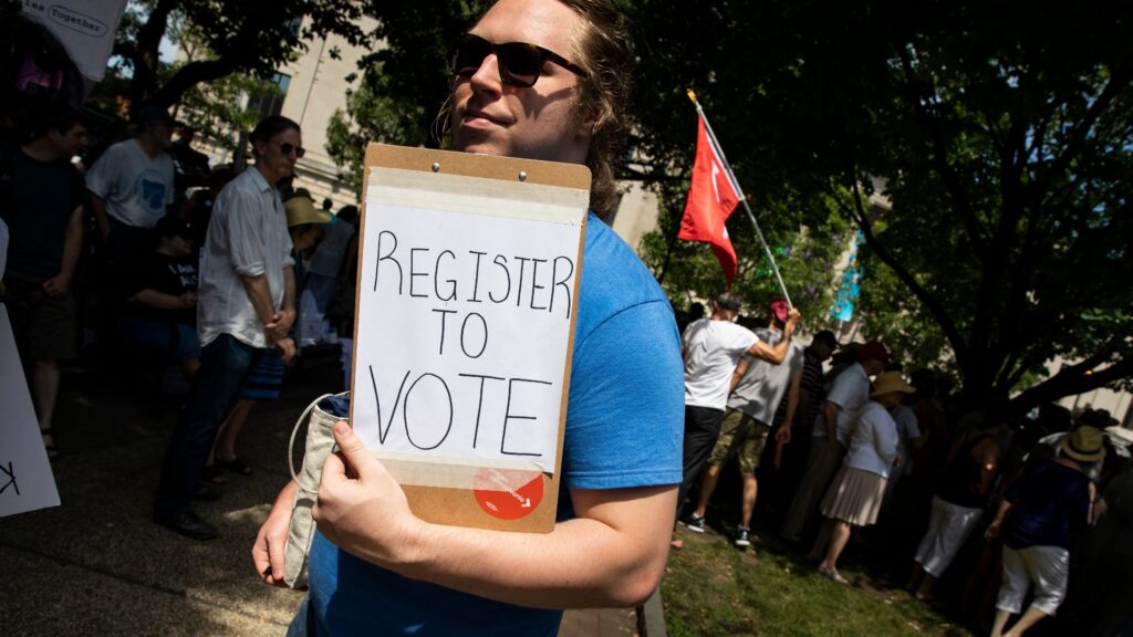 A voter registration volunteer in Philadelphia in 2018. New registrations had surged going into 2020 but have dropped off dramatically as a result of the coronavirus pandemic. A voter registration volunteer in Philadelphia in 2018. New registrations had surged going into 2020 but have dropped off dramatically as a result of the coronavirus pandemic. (Dominick Reuter/AFP via Getty Images)