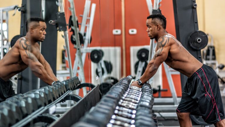 A man exercises at the gym.