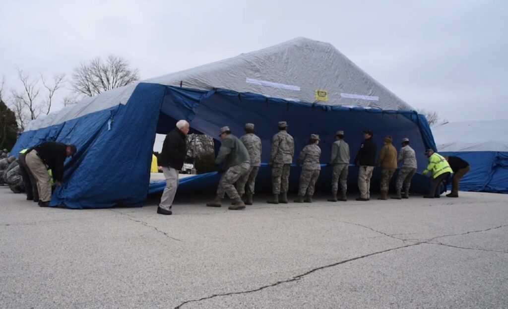 national-guard-covid-1920×1169 Nearly 80 members of the Pennsylvania National Guard are assisting Montgomery County Emergency Management Agency with operating a COVID-19 testing site in Upper Dublin Township, Montgomery County. (Master Sgt. George Roach / Pennsylvania National Guard)