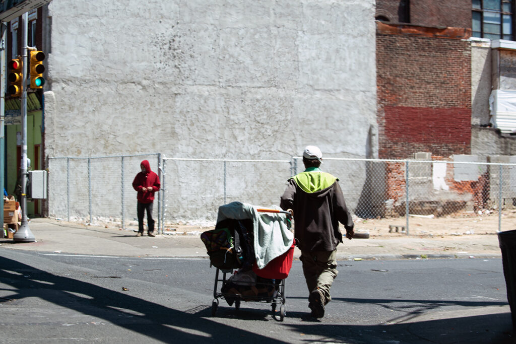 05-07-2020-1 A person walks with their belongings on Kensington Avenue on May 7, 2020. (Erin Blewett / Kensington Voice)