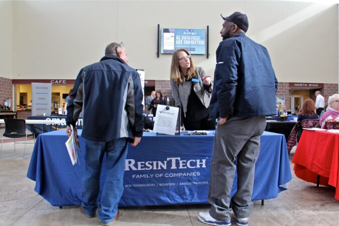 Maureen Martin talks with potential employees