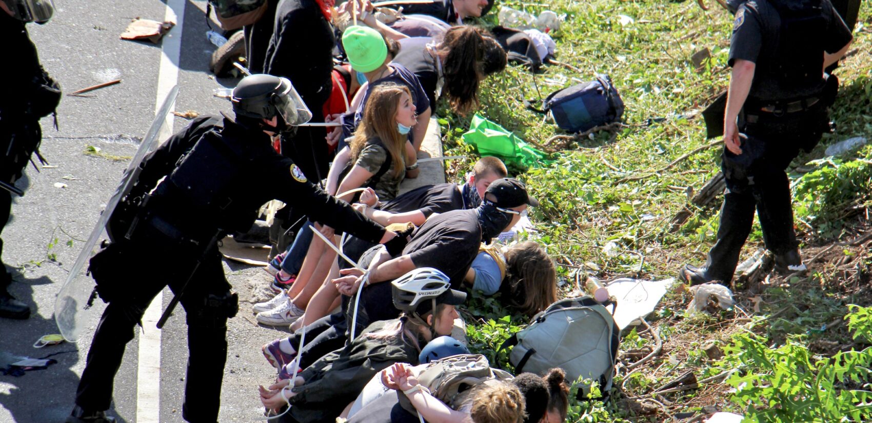 Police arrest dozens of protesters after they blocked traffic on the Vine Street Expressway