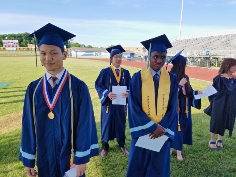 North Penn High School valedictorian Tony Xu (left) joins other graduation speakers at the high school stadium in Lansdale, where they delivered their speeches for a video recording. (Peter Crimmins/WHYY)