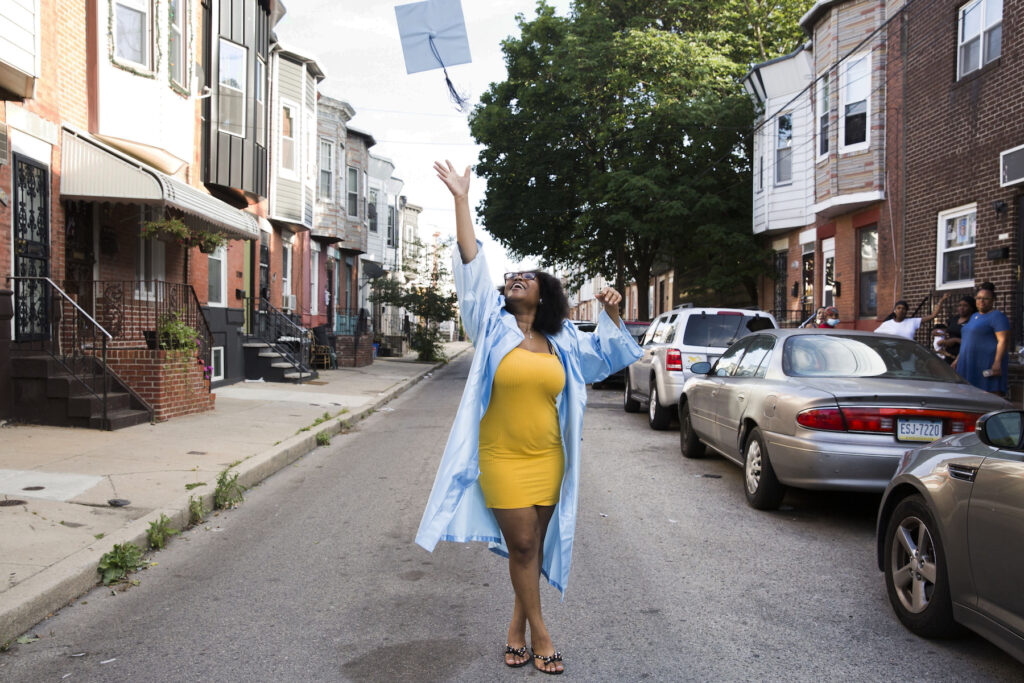 2020-06-10-r-wisniewski-aliah-harris-schooled-Paul-Robeson-high-school-grays-ferry-philadelphia-pa-4-2 Aliah Harris, 18, throws her graduation cap in celebration on her dad's South Philly block on June 10, 2020. (Rachel Wisniewski for WHYY)