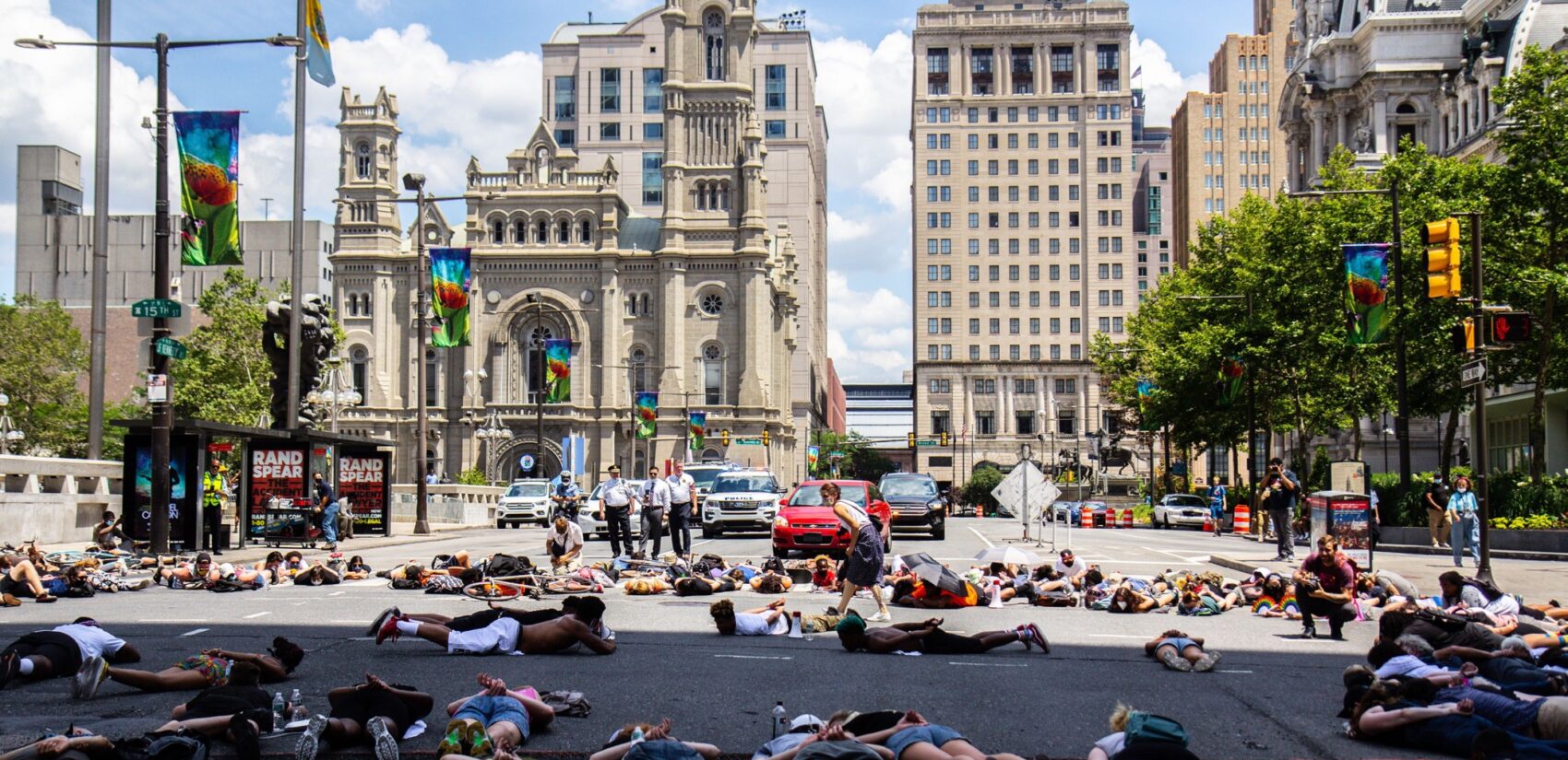 Protesters lay in the intersection of 15th and JFK