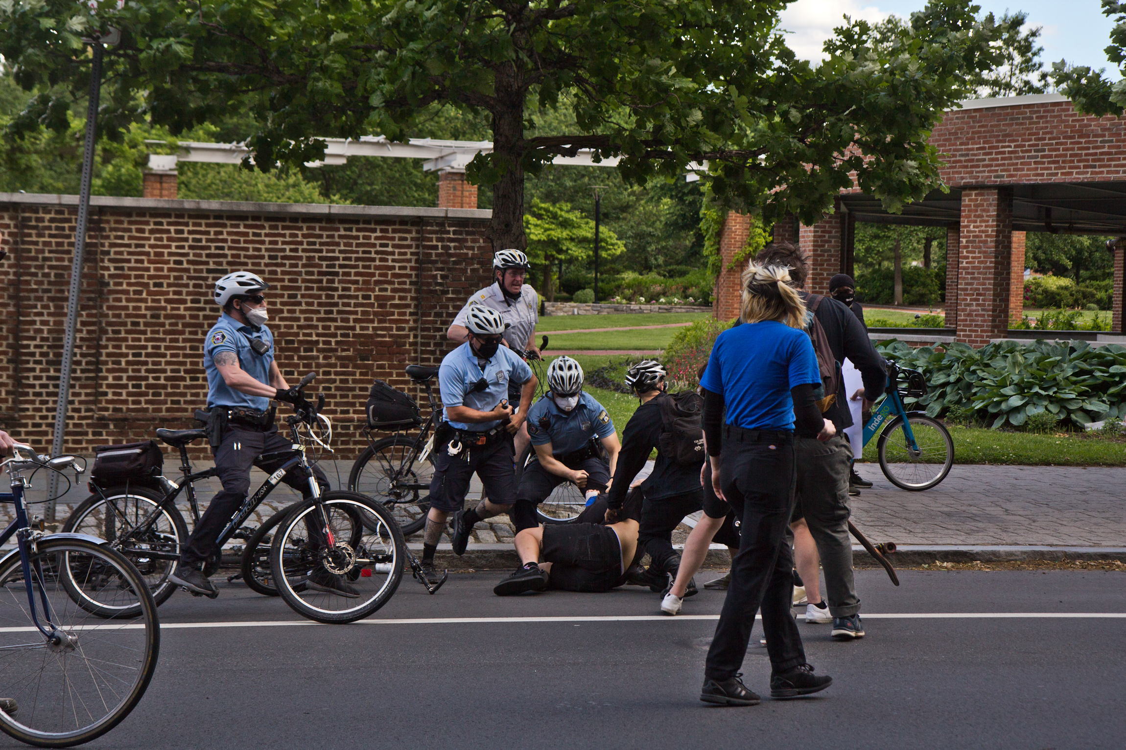 Police arrest a protester in front of Independence Mall