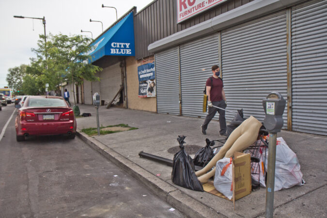 Trash was piled on the curb at 52nd Street