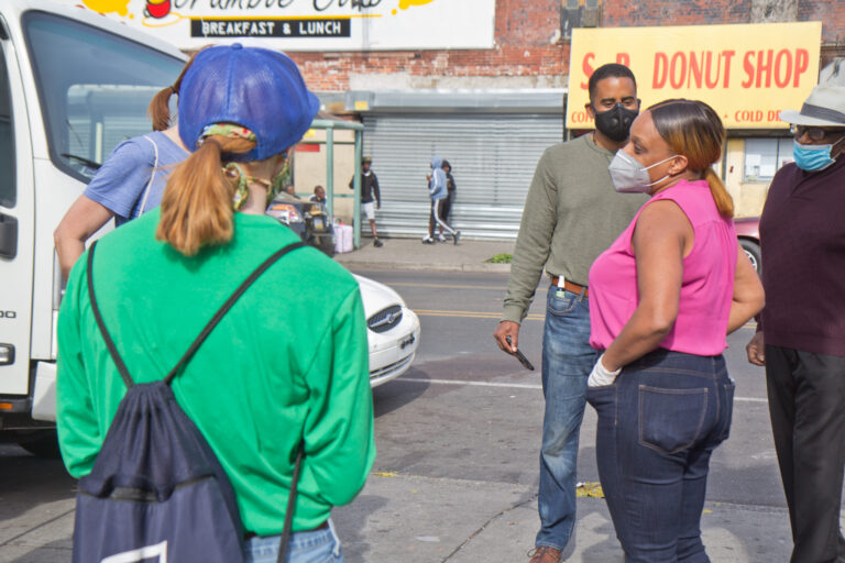 3rd District CouncilmemberJamie Gauther talks to clean-up volunteers in West Philadelphia. (Kimberly Paynter/WHYY)
