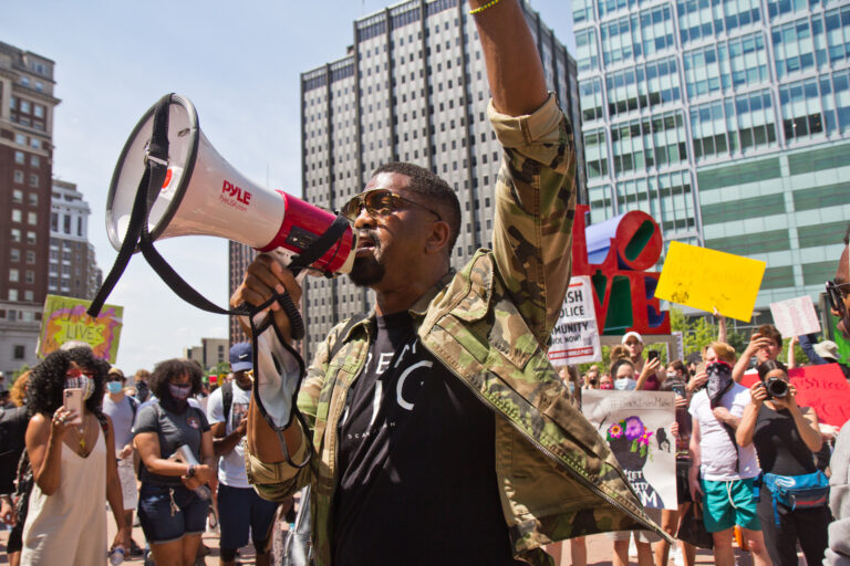 Sixx King, an activist and filmmaker, led a peaceful protest through Center City, Philadelphia Thursday afternoon. (Kimberly Paynter/WHYY)
