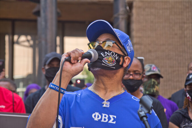 Reverend Dr. Alyn Waller of the Enon Tabernacle Baptist Church spoke at a protest outside the African American History Museum, calling for social reform in Philadelphia. (Kimberly Paynter/WHYY)