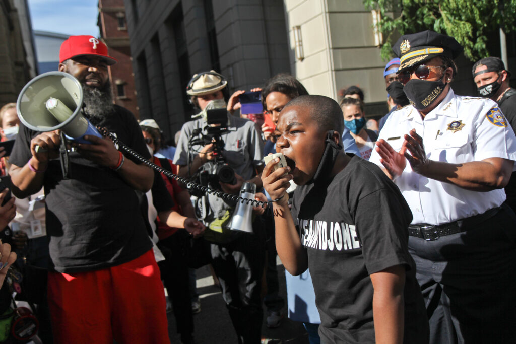2020 6 8 k paynter defender association march-13 Isaac Gardner, 11, joined chief defender Keir Bradford-Grey and Philadelphia County Sheriff Rochelle Bilal in protest of the Black lives lost to police brutality. (Kimberly Paynter/WHYY)