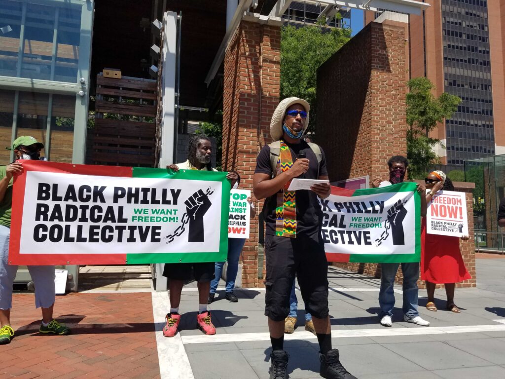 Mike Africa, Jr., reading list of demands as part of the Black Philly Radical Collective. (Peter Crimmins / WHYY)