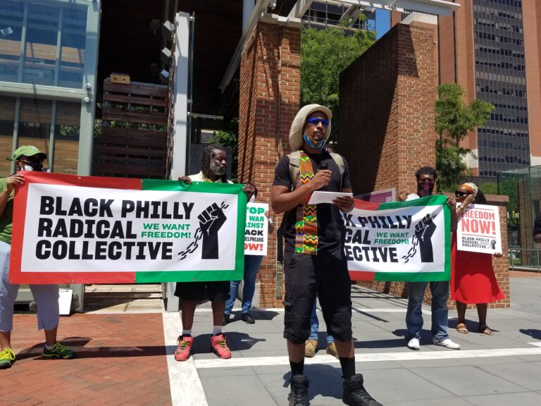 Mike Africa, Jr., reading list of demands as part of the Black Philly Radical Collective. (Peter Crimmins / WHYY)