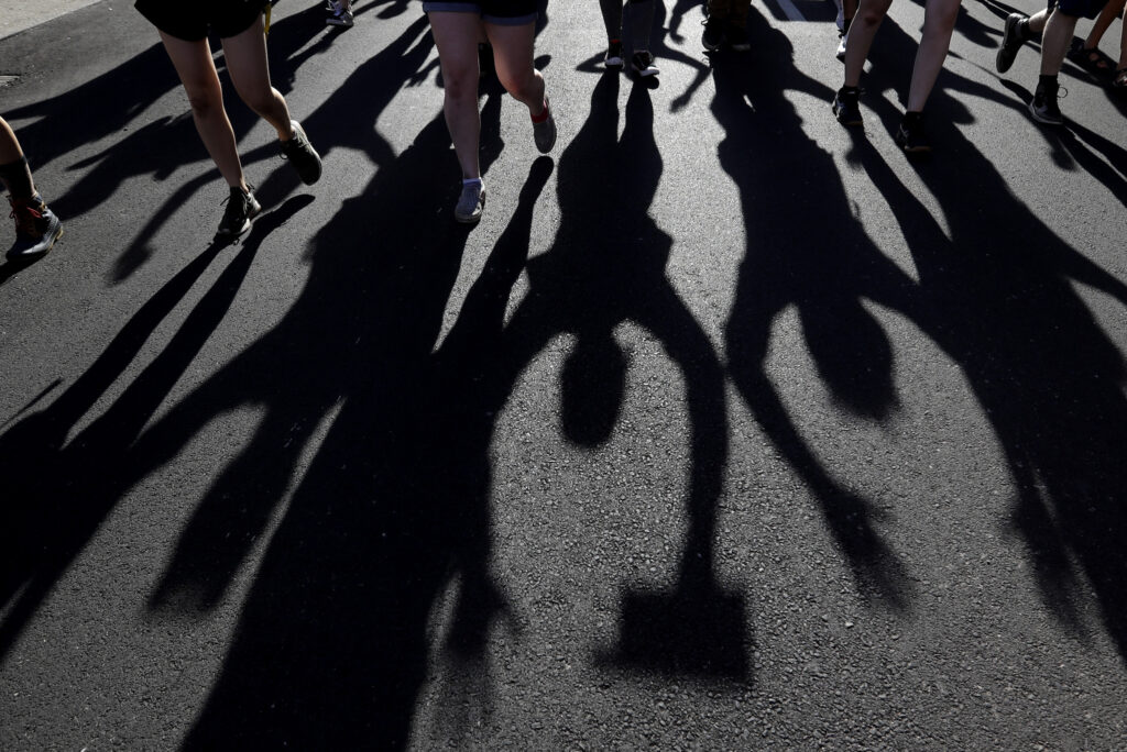Protesters raise their hands as they march over the deaths of George Floyd and Breonna Taylor, Monday, June 1, 2020, in Louisville, Ky. Breonna Taylor, a black woman, was fatally shot by police in her home in March.  (AP Photo/Darron Cummings)