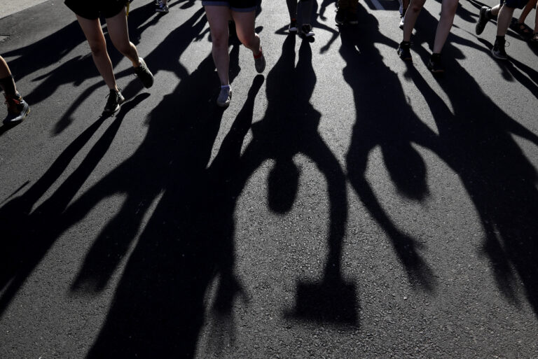 Protesters raise their hands as they march over the deaths of George Floyd and Breonna Taylor, Monday, June 1, 2020, in Louisville, Ky. Breonna Taylor, a black woman, was fatally shot by police in her home in March.  (AP Photo/Darron Cummings)