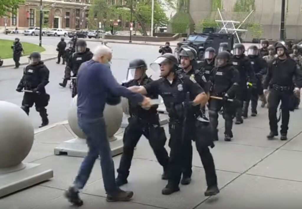 America Protests Buffalo In this image from video provided by WBFO, a Buffalo police officer appears to shove a man who walked up to police Thursday, June 4, 2020, in Buffalo, N.Y. (Mike Desmond/WBFO via AP)