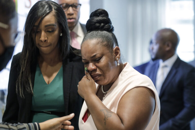 Tomika Miller, center, widow of Rayshard Brooks cries as she leaves a news conference, Wednesday, June 17, 2020 in Atlanta. Fulton County District Attorney Paul L. Howard Jr. announced former Atlanta Police Officer Garrett Rolfe faces charges including felony murder in the fatal shooting of Rayshard Brooks on June 12. (AP Photo/Byrnn Anderson)